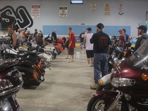 Motorcycle enthusiasts check out some bikes on display at the Pork Fest in Sundridge Ontario, which started June 29 and continues into Canada Day. Christian Paas-Lang / The Nugget