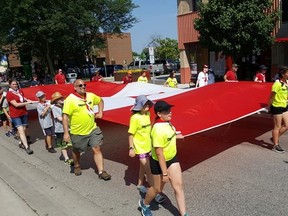 The Canada Day parade makes its way through downtown Chatham on Sunday. (TREVOR TERFLOTH/The Daily News)
