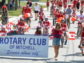 Rotarians Carolyn Deck (left) and Emilie Rose helped carry the Rotary banner and lead the pied piper parade Sunday, July 1. Watch for more photos on www.mitchell.advocate.com or the July 11 issue of The Advocate. ANDY BADER/MITCHELL ADVOCATE