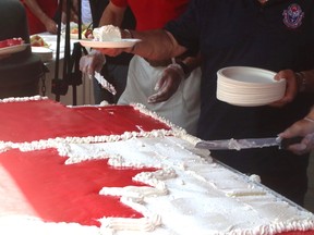 A giant Canadian flag cake gets served out at the Canada Day festivities at North Bay's waterfront. Christian Paas-Lang / The Nugget