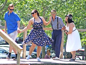 Attendees of the Vintage Day and Friends of Ukrainian Music Festival dance on a makeshift trailer-turned-stage during the June 24 festivities at the Ukrainian Cultural Heritage Village.

Jeff Labine/Postmedia Network