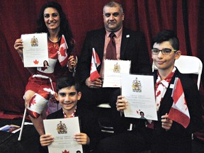 Laith Kachi and wife Rana Bihnam and their sons, Bashar, 11, and Rami, 7, became Canadian citizens at a special Canada Day citizenship ceremony held at the Boys and Girls Club. The ceremony was part of Brantford's Canada Day celebration. (Vincent Ball/The Expositor)