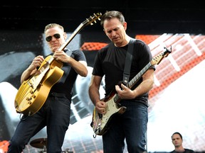 Bryan Adams, left, and Keith Scott performed at Stars and Thunder on Sunday, July 1. Adams performed songs from his compilation album, Ultimate, singing songs such as 'Heaven,' 'Summer of '69' and 'Have You Ever Really Loved a Woman?' Joshua Santos/The Daily Press.