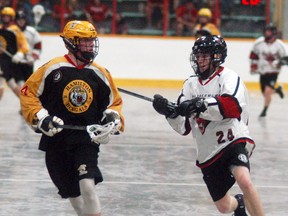 David Gough/Courier Press/DGough@postmedia.com  
Wallceburg Red Devils defenceman Korey Conroy defends a Hamilton player during Game 1 of their playoff series, on Friday, June 22 at Wallaceburg Memorial Arena.