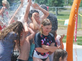 Children enjoying the new Adelie Splash Pad at Coniston’s Centennial Park. The grand opening for the splash pad, along with the Community Gardens Greenhouse was held on Sunday. (Keith Dempsey/For The Sudbury Star)