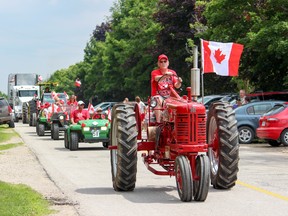 Tractors, combines and a plethora of other farm equipment graced the streets of Oxford County for the parade on Monday. (Chris Funston/Sentinel-Review)