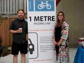 Jon Hepplewhite (left) owner of Port Elgin's Rabbit Dash and Saugeen Shores Recreation Supervisor Lisa Billing, handed out coffee, water and snacks to cyclists riding to work between 7 and 9 a.m. June 28 in Port Elgin. Steve Cornwell