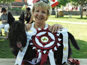 Karin Kirkland with Katie, her 11-year-old Scottish terrier,  who won three ribbons, including best overall dog, at the annual Canada Day Canine Classic dog show in Port Dover on Sunday. Vincent Ball/Postmedia Network