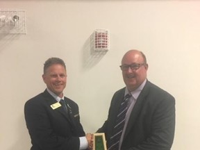 Kelly Simpson (right) was recently recognized with a Service Award for coaching by the Saskatchewan High School Athletics Association.