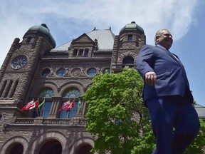 Ontario premier-elect Doug Ford walks out onto the front lawn of the Ontario Legislature at Queen's Park in Toronto on June 8, 2018. Though he officially takes up the premier's mantle on Friday, Doug Ford has already set the wheels in motion for several of his plans for Ontario -- and one expert predicts the Progressive Conservative leader will move quickly on his agenda once he seizes the reins of the province. In the weeks since his party's sweeping victory at the polls, Ford has vowed to make dismantling the province's cap-and-trade system his first order of business, a move that led to the cancellation of several green energy initiatives funded through the program. THE CANADIAN PRESS/Frank Gunn
