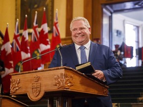 Ontario Premier Doug Ford says his government will officially begin winding down all green programs funded through the province's cap-and-trade system this week. Ford speaks as he is sworn in as premier of Ontario during a ceremony at Queen's Park in Toronto on Friday. (Mark Blinch/Canadian Press)