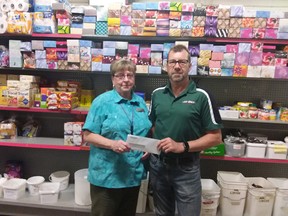Contributed Photo
High Def Auto Detailer in Tillsonburg recently celebrated their Grand Opening day by having a Charity Barbecue and donating $250 to the Helping Hand Food Bank. Dave Mels presents the cheque to Joan Clarkson, Food Bank Coordinator.