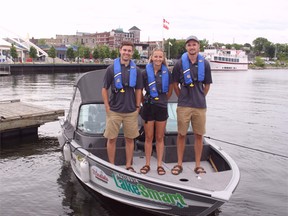 The LakeSmart Team of Krista Robertson (centre), invasive species liaison and LakeSmart stewardship technicians Reed Cupeiro (left) and Myles King ready to depart from Kenora Harbour on the first day of the Summer 2018 program, Tuesday, July 3.
Reg Clayton/Miner and News