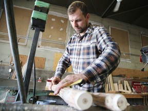 Chris Gatien, owner and head craftsman of Rustic Craft, works in the shop at 1921 Skead Road last week. Gatien and his wife Lauren purchased the business last November. (Gino Donato/Sudbury Star)