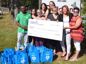 The Plasman Group donated $2,000 in specialized toys to the Children's Treatment Centre Foundation of Chatham-Kent. Shown are Eric Dubois from the Plasman Group, Crystal Gagnon, Shauna Jackson, Paula Giroux from the Plasman Group, Cheryl-Lynn Webster, Heather Sarson, Shauna Hatch from the Plasman Group and Koren Randal from the Plasman Group. Handout/Postmedia Network