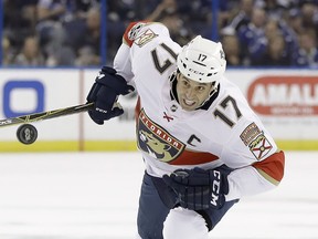 Florida Panthers center Derek MacKenzie chases the puck during the first period of an NHL hockey game against the Tampa Bay Lightning on Friday, Oct. 6, 2017, in Tampa, Fla. Chris O'Meara/Associated Press
