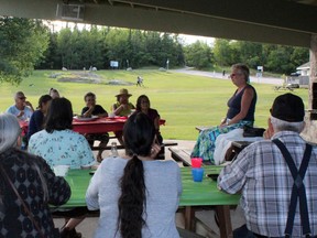 Meg Illman-White speaks about the ideas behind Babaamaashi during a feast at Anicinabe Park on Wednesday, June 27. The project, which aims to foster stronger connections to the land through family activities like blueberry picking and wild rice harvesting, will run on a trial basis this summer.
KATHLEEN CHARLEBOIS/DAILY MINER AND NEWS