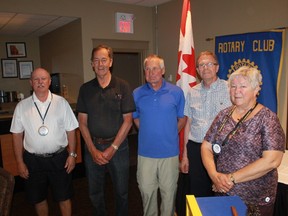 Members of the Rotary Club of Sarnia-Bluewaterland stand with winners of the Paul Harris Fellowships on June 27. From left to right: Rotarian Lawrie Lachapelle, Art DeGroot (representing his late wife and fellowship winner, Thea DeGroot), Rotary club president Henry Kulik, recipient Earl McMillan and Rotarian Kathy Markham.
CARL HNATYSHYN/SARNIA THIS WEEK