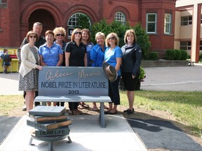 Central Huron Mayor Jim Ginn (back left) and BIA Beautification Committee Chair Marilyn Tyndall (front left) pose with reps from Libro Credit Union. The bench was a collaboration between the Municipality of Central Huron, the Central Huron BIA, and Libro Credit Union. (SHEILA PRITCHARD/CLINTON NEWS RECORD)