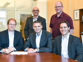 Mark Harfensteller of Isotopen Technologien München (ITM), seated at left, signs a Memorandum of Understanding with Bruce Power's vice president of corporate affairs and environment James Scongack, front middle, to explore the production of the medical radioisotope Lutetium-177 in Bruce Power’s reactors. Lutetium-177 is used in Targeted Radionuclide Therapy to treat cancers like neuroendocrine tumours and prostate cancer. Medical-grade Lutetium is used to destroy cancer cells while leaving healthy cells unaffected. Also in the photo is (front right) Pat Dalzell - Senior Strategist, Bruce Power Corporate Affairs, Ingo Russnak - Supply Chain Manager at ITM,  and Kurt Wigle - Bruce Power’s Department Manager, Waste Management and Isotopes.