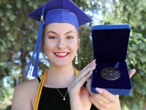 Selkirk Comp student and recent 2018 graduate Deirdre Rooney shows off the Governor General Bronze Medal after receiving her high school diploma. (Brook Jones/Selkirk Journal/Postmedia Network)