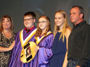 Hannah Steinke’s family presented Alissa Fleury and Zack Hossack with the Hannah Steinke Memorial Award; Steinke, a popular student at SCI, died earlier this year. (Juliet Kadzviti/Interlake Publishing)