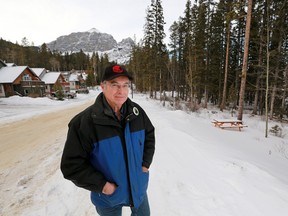 Gavin Young, Calgary Herald CANMORE, AB: JANUARY 13, 2015 - Canmore resident Steve Hrudey stands near a forested area in Peaks of Grassi in January 2015 that residents are fighting to maintain as an area of urban reserve after proposals were introduced to rezone it for new development.