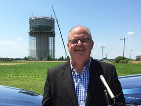 Chatham-Kent PUC general manager Tim Sunderland stands in front of Dresden's water tower, which recently underwent a $2.3-million rehabilitation, on July 4. David Gough/Postmedia Network