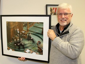 Chatham-Kent-Leamington MPP Rick Nicholls displays a photo of him serving as Deputy Speaker in the Ontario legislature in this file photo. File Photo/Postmedia Network