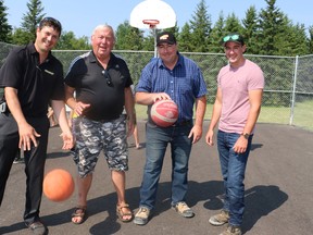 Community and commercial volunteers included Richard Lapointe of ReadyQuip, left, Micky Auger, Aaron Savord of Custom Concrete and Michael Watson of Miller Paving.
 LEN GILLIS / Postmedia Network