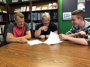 BRUCE BELL/THE INTELLIGENCER
Jackson Cleave (left) and Quintin Lichty (right) get some instruction from Summer Company coordinator Liz Kryschuk at the Small Business Centre at Loyalist College on Thursday. The program aims to assist young entrepreneurs start their own company.