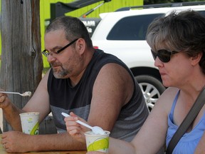 BEN COHEN/Sault Star
Darryl and Leanne Osborne beat the heat with some ice cream in the shaded patio of Big Moose Ice Cream on Thursday afternoon.