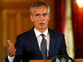 Henry Nicholls/Getty Images
NATO Secretary General Jens Stoltenberg speaks during a news conference with British Prime Minister Theresa May inside 10 Downing Street on June 21 in London, England.
