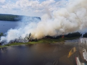 The forest fire North Bay 21 burns on the northeast shore of Lake Temagami on Tuesday afternoon. Ministry Photo