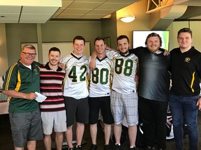 Sherwood Park Bantam Rams head coach Jim Skitsko, left, with several of his former players who have been awarded college bursaries this year. Photo Supplied