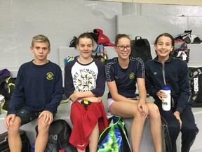 (Left to Right) Aidan Pilgrim, Hunter Helberg, Naomi Slee and Maya Slee compete in the Swim Alberta Summer Championships in Calgary, Alta. Supplied image/Stephanie Slee