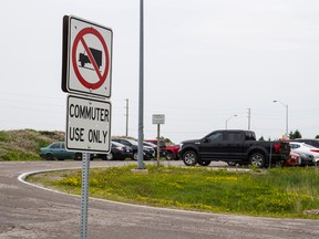 Two people have been charged after three vehicles were set on fire in a carpool parking lot on Abbott Court on June 19. They also face charges from motor vehicle thefts and other vehicle fires across the city. (Alex Vialette/The Expositor)