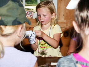 Jonathan Ludlow photos/The Intelligencer
O’Hara Mill Homestead is running a summer camp through July and August for kids age 6-9 to come and enjoy nature and learn about older times. Christy Howard examines the puppet she made.