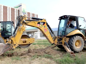 Mayor Randy Hope and Tony Santo, CEO of Gateway Casinos & Entertainment Limited, took a turn breaking the ground for the site of the Cascades Casino in Chatham, Ont. on Thursday July 5, 2018. Fallon Hewitt/Chatham Daily News/Postmedia Network