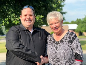 Steve Pratt, who has been named the new CEO of the United Way of Chatham-Kent, is congratulated by current CEO Karen Kirkwood-Whyte, who is retiring after more than three decades with the agency. (Handout/Chatham Daily News)