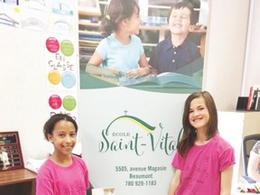 Livia Rainville (left) and Marie-Soleil Breton published their first novel, The Spooky Mystery at Sunset Camp, earlier in June. The two École Saint-Vital students are already working on their second novel. (Submitted)