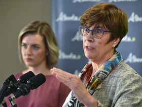 Doctors Karen Grimsrud (R) and Elaine Hyshka, co-chairs of the Minister’s Opioid Emergency Response Commission. providing an update on opioid use at a news conference in Edmonton, July 5, 2018. Ed Kaiser/Postmedia