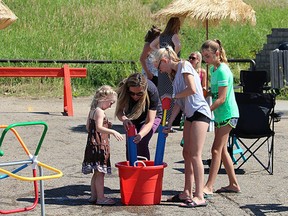 Attendees participate in several activities at the Millennium Place skate park for the first Wellness on Wheels event on Wednesday, July 26, 2017.

File Photo