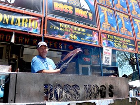 Jamie Stoddart, of Boss Hogs, shows off a rack of ribs at the Chatham Ribfest in Tecumseh Park on Friday, July 6, 2018. Stoddart, who has been on the circuit for two years, is looking forward to a weekend of ribs and entertainment. Fallon Hewitt/Chatham Daily News/Postmedia Network