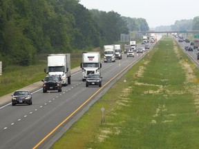 West of London to Tilbury, the 401’s east- and westbound lanes are separated by an open, grassy median. (MIKE HENSEN, The London Free Press)