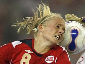 Norway's Solveig Gulbrandsen (left) and Canada's Martina Franko fight for the ball during their group soccer match of the 2007 FIFA Women's World Cup. (REUTERS/Nir Elias)