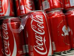 Cans of Coca Cola on display. REUTERS/Joshua Lott