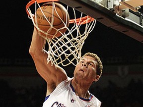 Clippers forward Blake Griffin slam dunks against the Spurs in Mexico City on October 12, 2010. (HENRY ROMERO/Reuters)