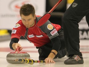 Skip Mike McEwen throws a rock during the Safeway Championship in Beausejour, Man. Friday, Feb. 11, 2011. (MARCEL CRETAIN/Winnipeg Sun)
