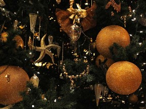 Decorations hang on the $11-million Christmas tree, standing at 13 metres tall and decorated with necklaces, watches and bracelets with more than 180 diamonds, pearls, emeralds, sapphires and other precious stones, in the lobby of the Emirates Palace in Abu Dhabi Dec. 16, 2010. (Fahad Shadeed/REUTERS)